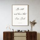 'Be Still, and know that I am God' psalm 46:10 text wall art piece hanging on a living room wall
