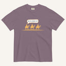 a wine purple t-shirt with 3 men riding camels in the color yellow with a chat bubble with the text "are we there yet?"
