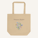 Beige tote bag with floral design and 'Farmers Market' text on a white background