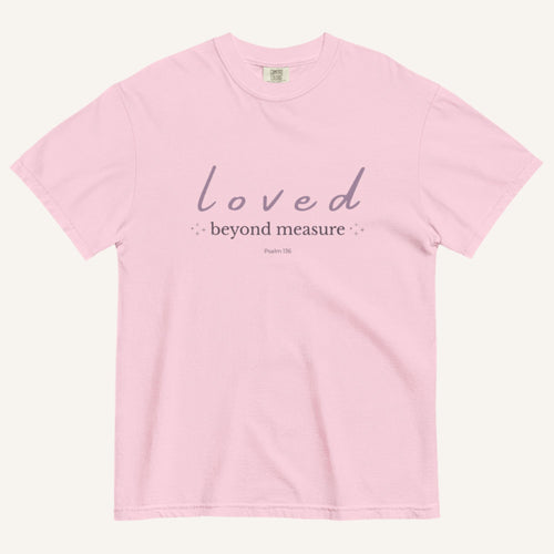 Pink t-shirt with 'loved beyond measure' text on a white background