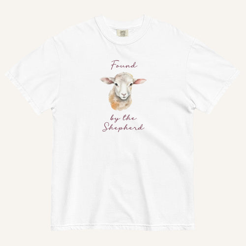 white t-shirt with watercolor lamb and 'Found by the Shepherd' text on cream background
