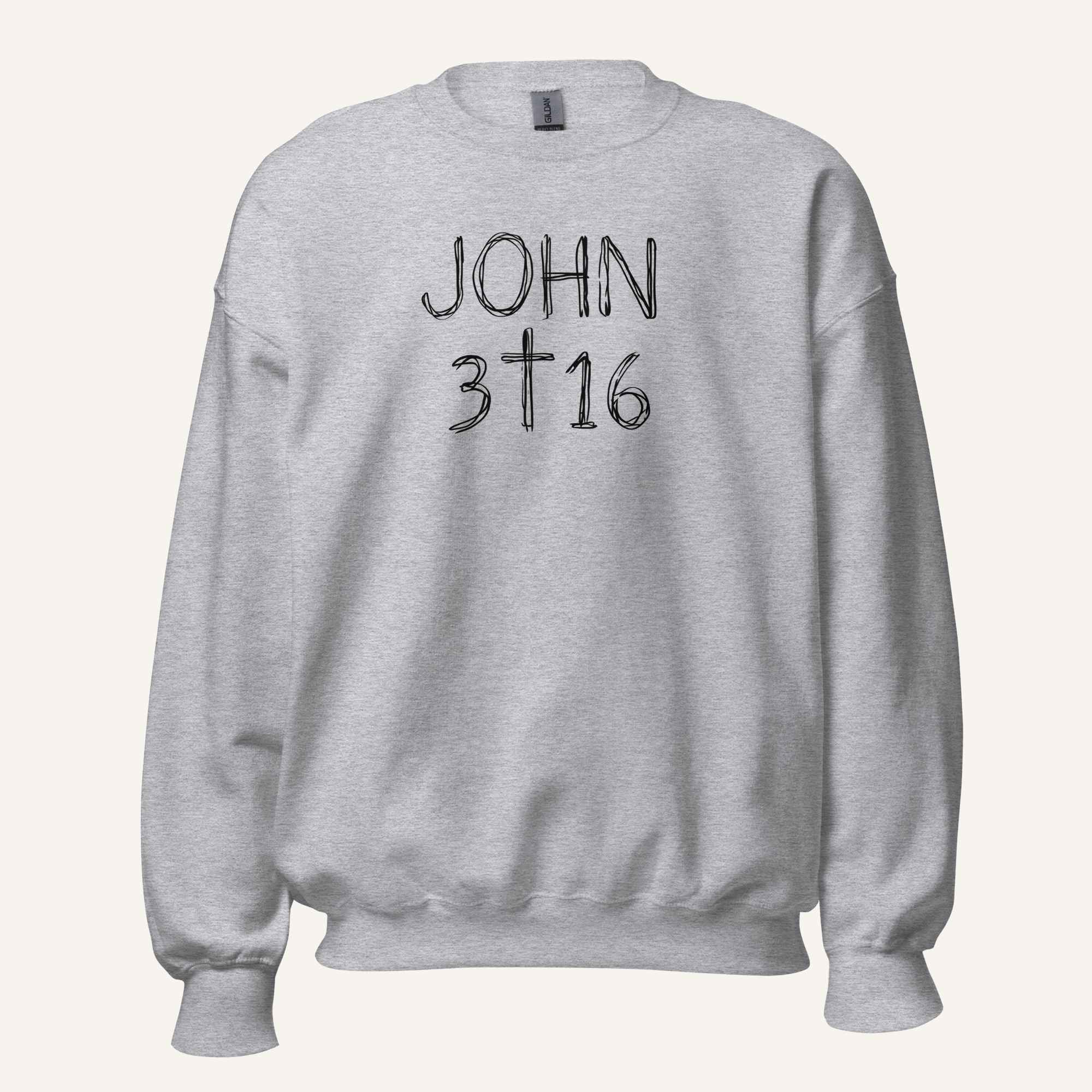 a light grey crewneck sweatshirt with 'John 3 16' text with cross graphic between the 3 & 16 on a light cream background