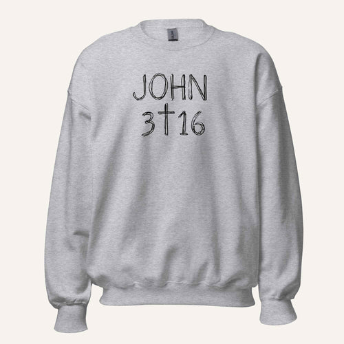 a light grey crewneck sweatshirt with 'John 3 16' text with cross graphic between the 3 & 16 on a light cream background