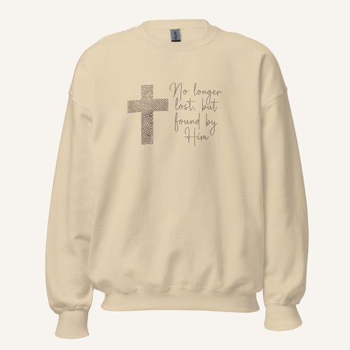 cream sweatshirt with cross design and 'No longer lost, but found by Him' text on a cream background