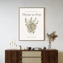 wall art of 'Thyme to Pray' text with thyme graphic in a neutral living room
