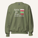 Olive green unisex crewneck sweatshirt featuring a Christmas design with the phrase “Fueled by Jesus …and peppermint mochas,” peppermint illustrations, and a festive red and green peppermint mocha cup graphic.