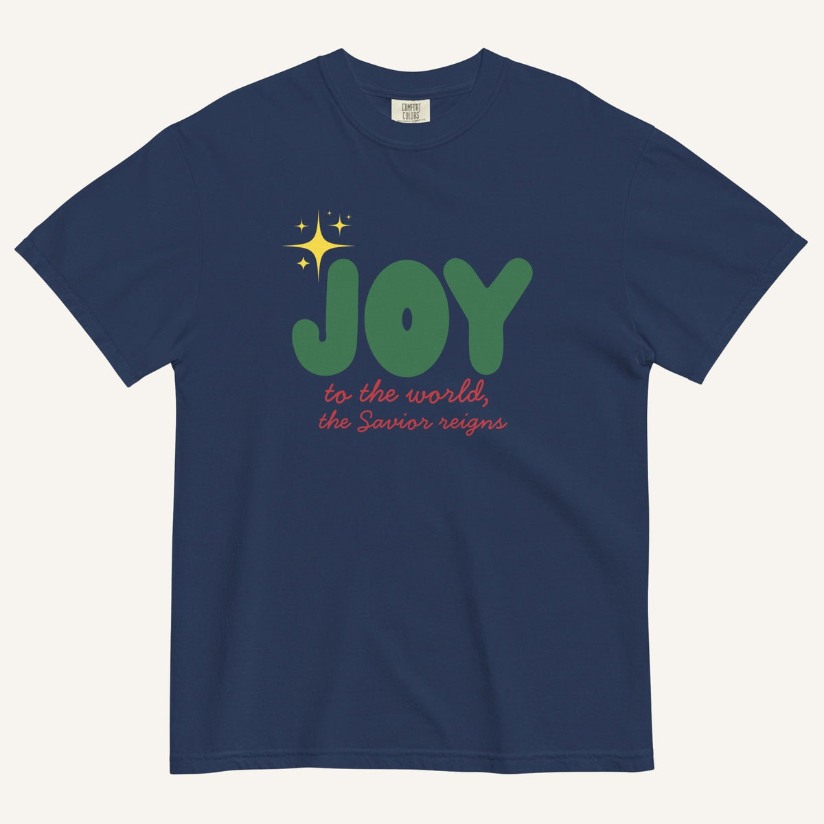 a navy t-shirt with the words "Joy to the world, the Savior reigns" in bold colorful font with a star graphic