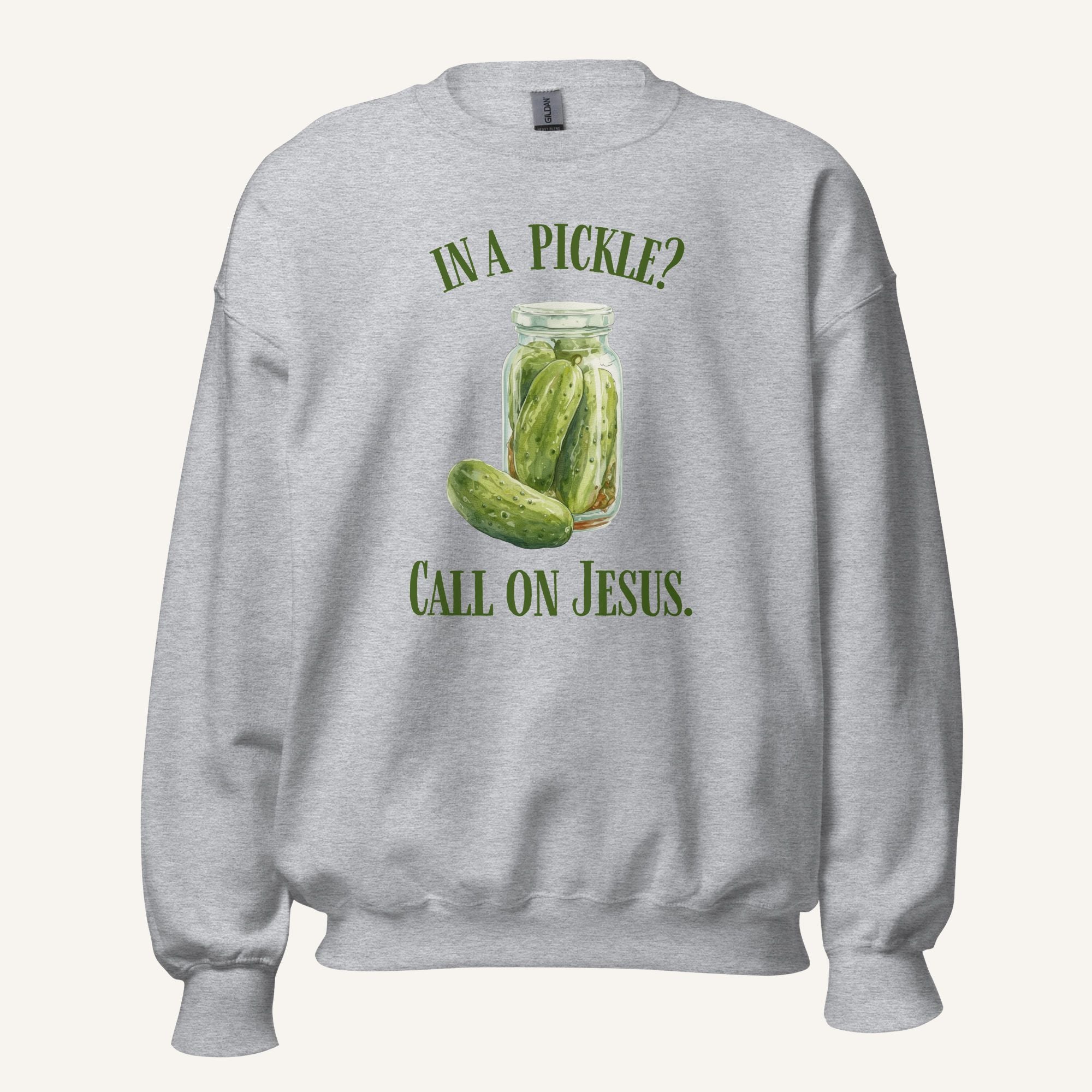 grey crewneck sweatshirt with a pickle jar graphic and 'In a Pickle? Call on Jesus' text on a cream background