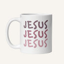 White 11 oz mug with 'JESUS JESUS JESUS' printed in pink on a white background