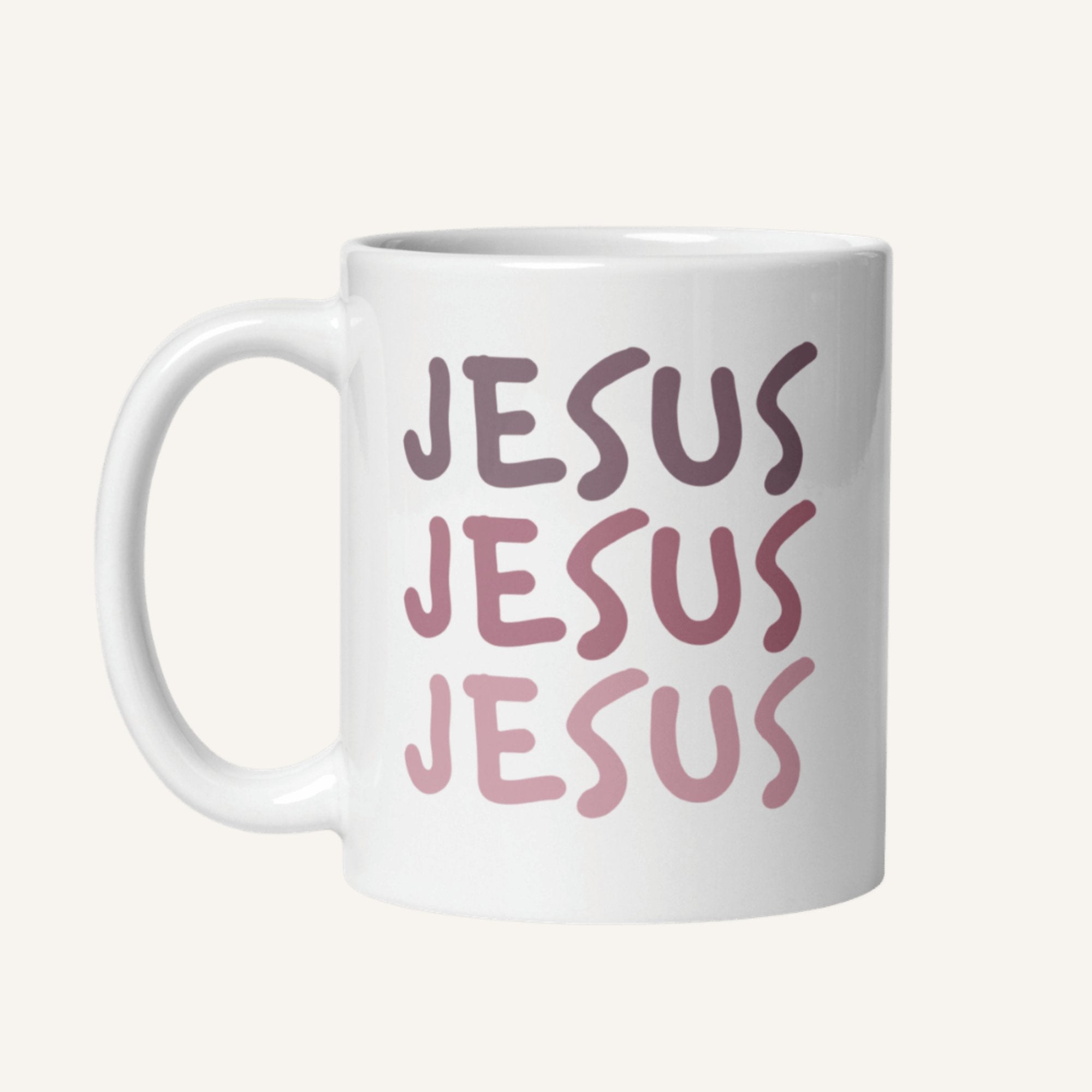 White 11 oz mug with 'JESUS JESUS JESUS' printed in pink on a white background