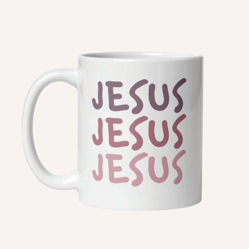 White 11 oz mug with 'JESUS JESUS JESUS' printed in pink on a white background
