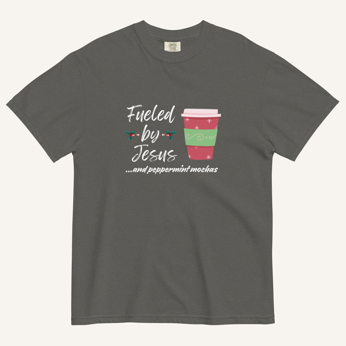 Grey Christmas T-shirt featuring the phrase “Fueled by Jesus …and peppermint mochas” with a festive peppermint mocha cup design.