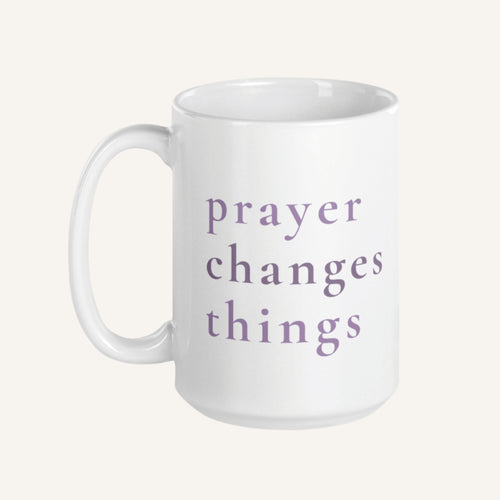 White 15 oz mug with 'prayer changes things' text in purple on a white background