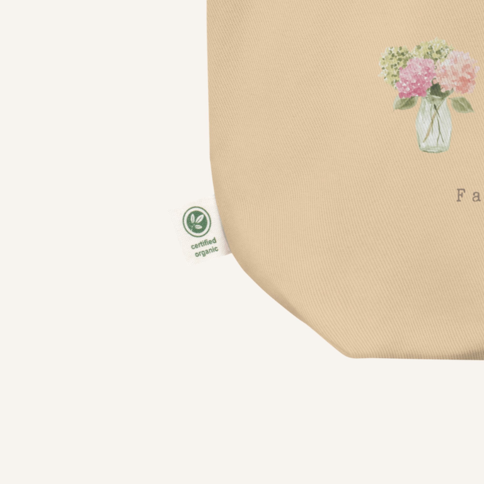 Beige product with floral design and certification logo on a white background