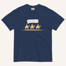a navy blue t-shirt with 3 men riding camels in the color yellow with a chat bubble with the text "are we there yet?"