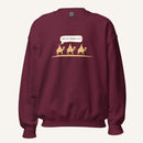 Burgundy unisex crewneck sweatshirt featuring a gold desert scene with three camels and a speech bubble reading “Are we there yet?”