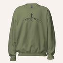 A military green crewneck sweatshirt featuring a black line art graphic of a cross on top of simple mountains on the chest, displayed against a solid off-white background.