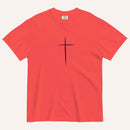 A short-sleeve crewneck t-shirt in a paprika red color, featuring a simple black Christian cross printed on the center chest. The t-shirt is laid flat against a solid, warm off-white background.