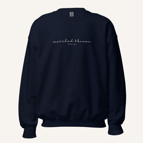 navy sweatshirt with 'Searched & known' text