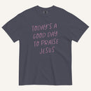 navy t-shirt with 'Today's a Good Day to Praise Jesus' pink text on a cream background