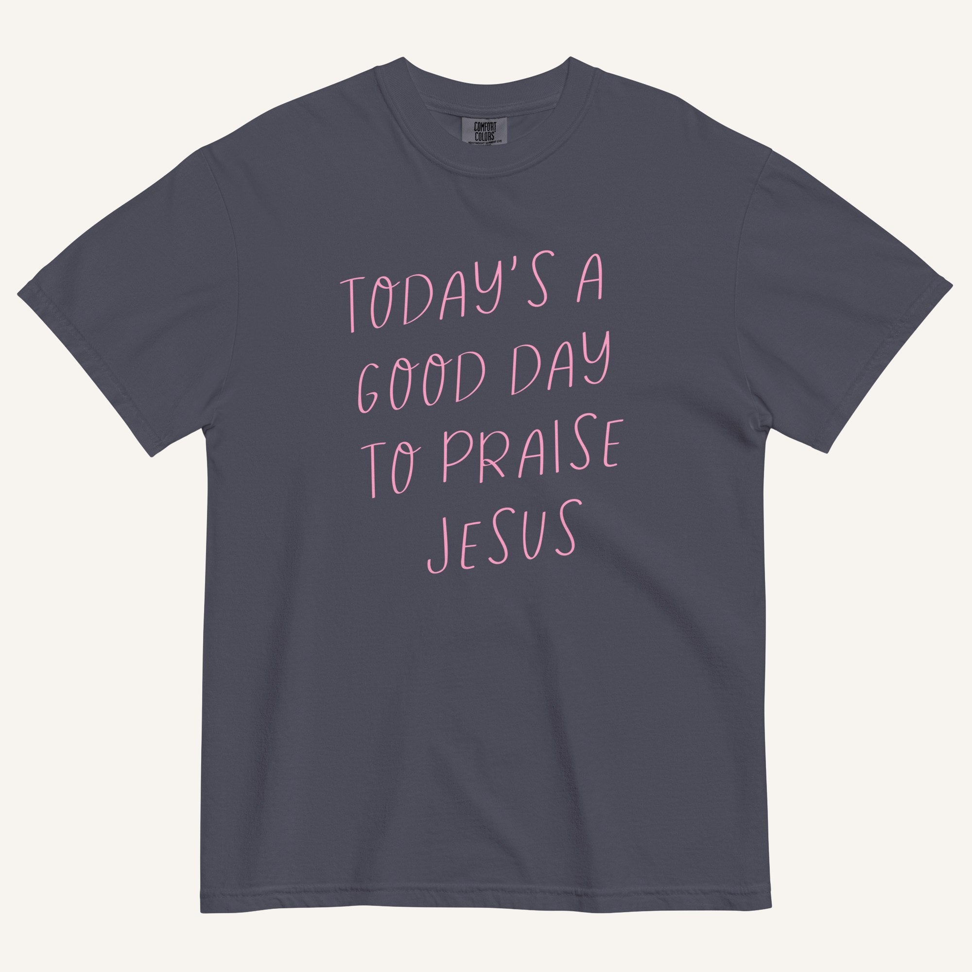 navy t-shirt with 'Today's a Good Day to Praise Jesus' pink text on a cream background