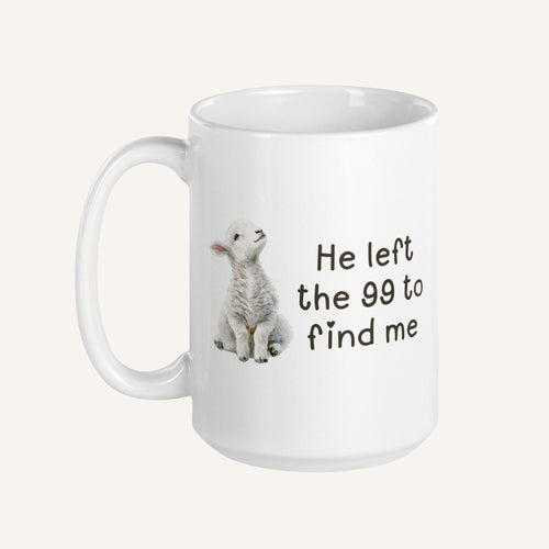 white 15 oz mug with a water color lamb and 'He left the 99 to find me' text on a cream background