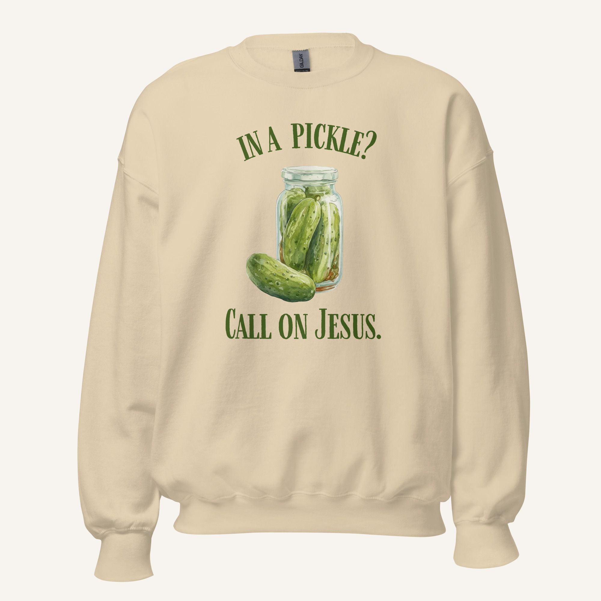 beige crewneck sweatshirt with a pickle jar graphic and 'In a Pickle? Call on Jesus' text on a cream background
