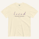 Beige t-shirt with 'loved beyond measure' text on a white background