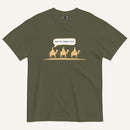 an army green t-shirt with 3 men riding camels in the color yellow with a chat bubble with the text "are we there yet?"