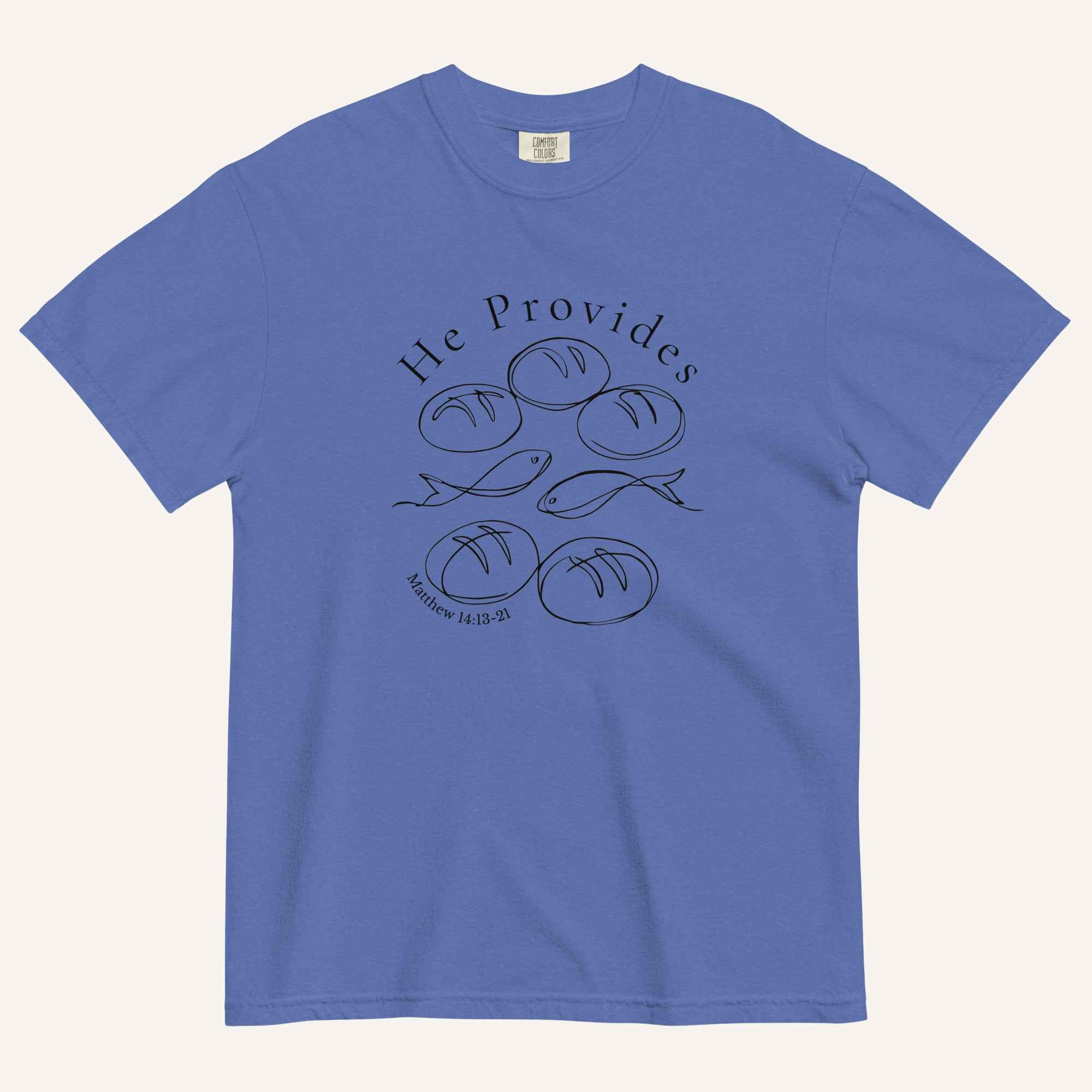 A blue short-sleeve t-shirt with a black graphic print on the front showing fish and loaves of bread, with the text 'He Provides' and 'Matthew 14:13-21'.