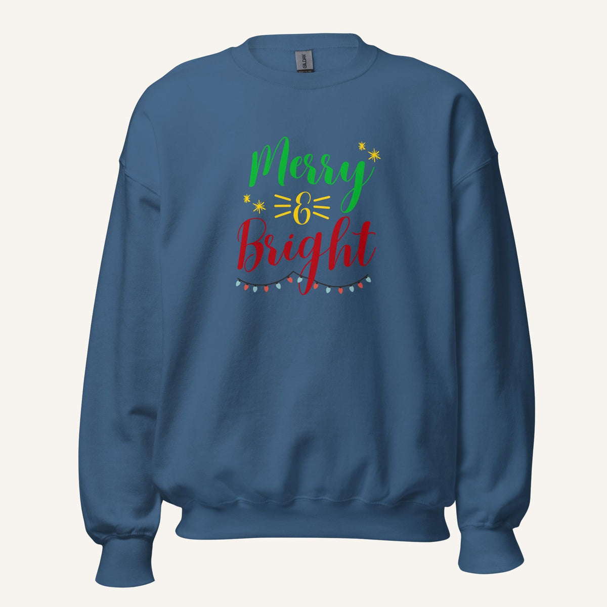 blue crewneck sweatshirt with "Merry & Bright" colorful text with Christmas lights and star graphics