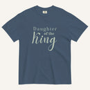 Blue t-shirt with 'Daughter of the King' text on a white background