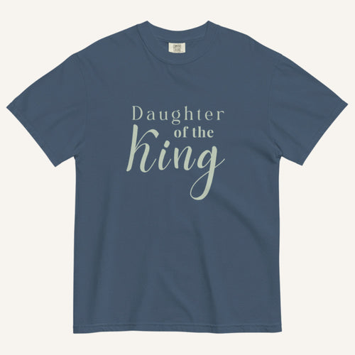 Blue t-shirt with 'Daughter of the King' text on a white background