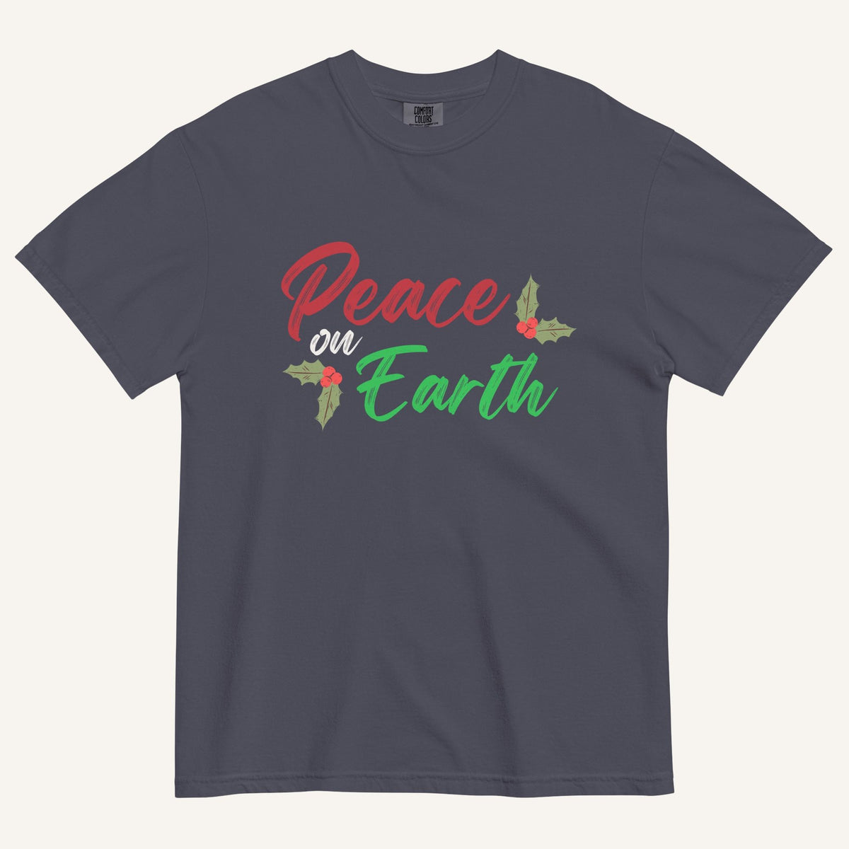 a navy t-shirt with the text "Peace on Earth" and small botanical graphics