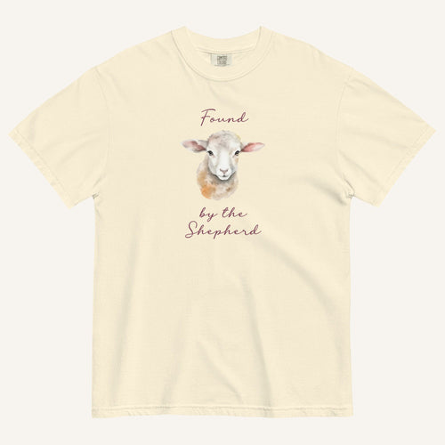 Ivory t-shirt with watercolor lamb and 'Found by the Shepherd' text on cream background