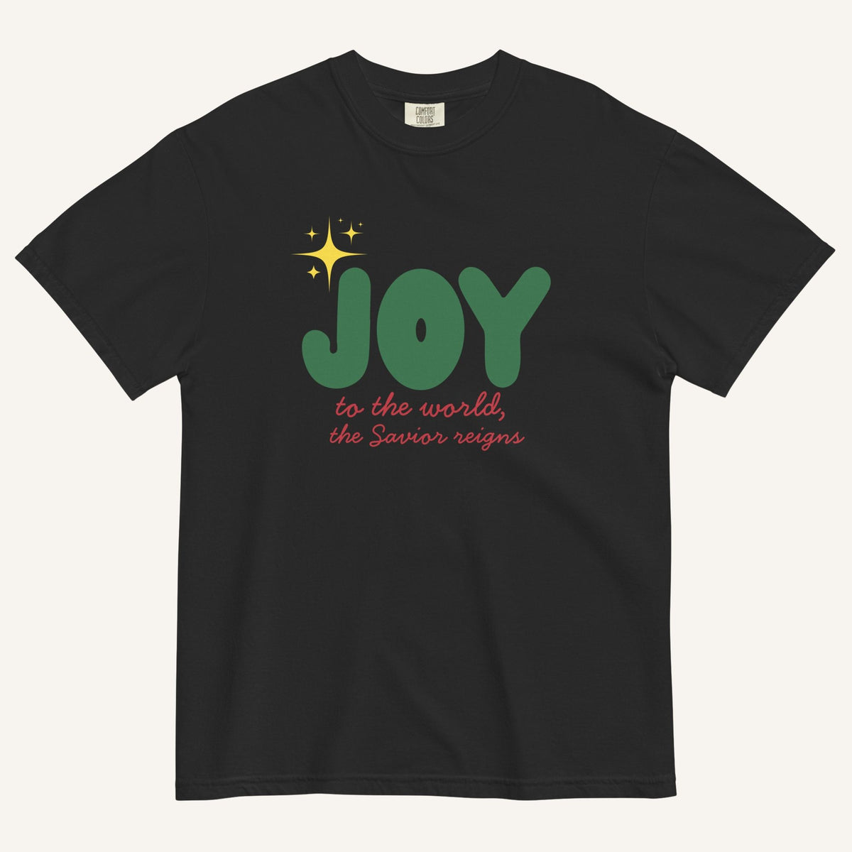 a black t-shirt with the words "Joy to the world, the Savior reigns" in bold colorful font with a star graphic