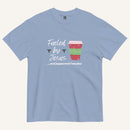 light blue Christmas T-shirt featuring the phrase “Fueled by Jesus …and peppermint mochas” with a festive peppermint mocha cup design.