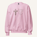 pink sweatshirt with cross design and 'No longer lost, but found by Him' text on a cream background