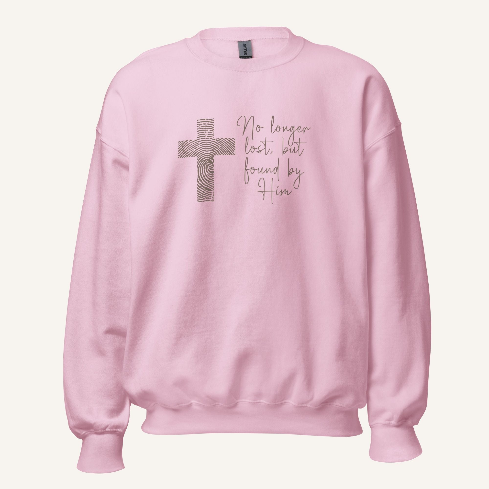 pink sweatshirt with cross design and 'No longer lost, but found by Him' text on a cream background