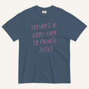 muted blue t-shirt with 'Today's a Good Day to Praise Jesus' pink text on a cream background