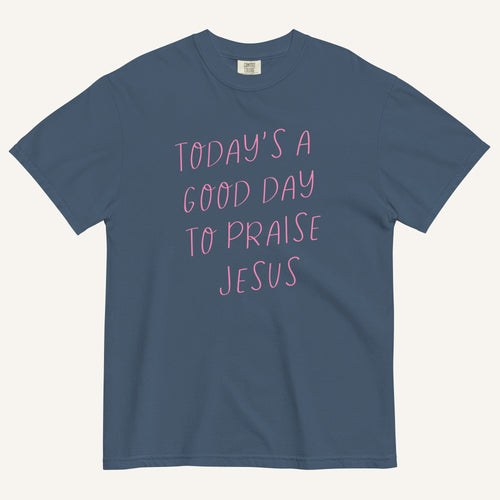 muted blue t-shirt with 'Today's a Good Day to Praise Jesus' pink text on a cream background