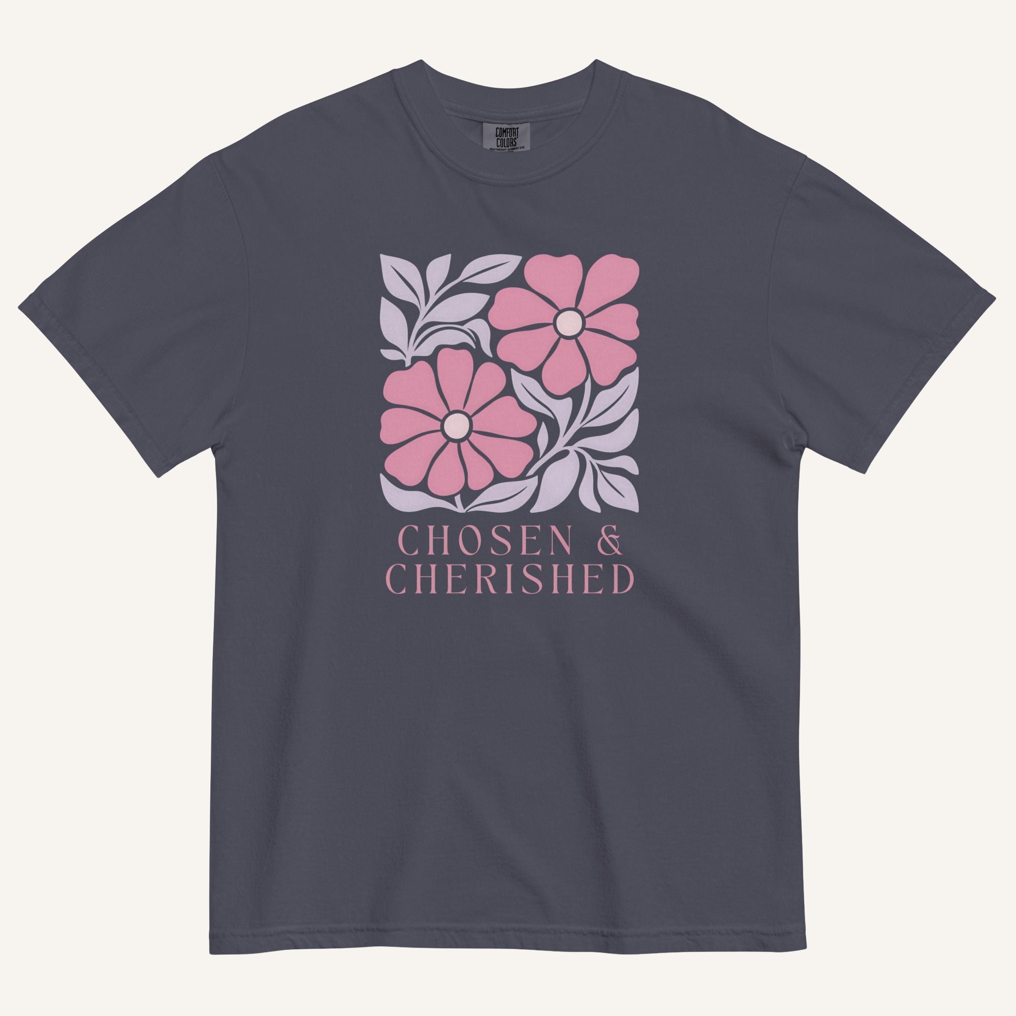 navy t-shirt with floral graphic and 'Chosen & Cherished' text on a cream background