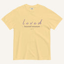 Yellow t-shirt with 'loved beyond measure' text on a white background