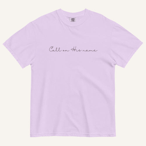 Light purple t-shirt with text 'Call on his name' on a white background