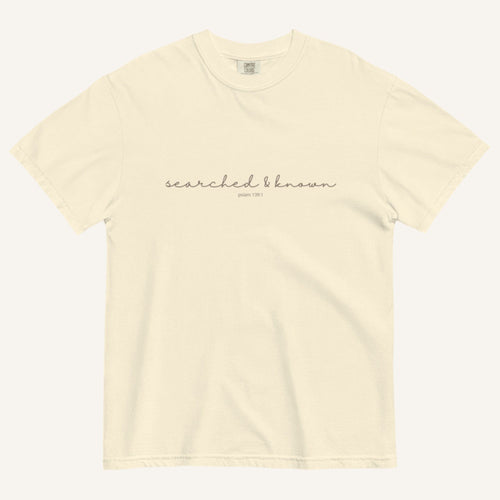 Ivory t-shirt with 'Searched & Known' text on a cream background