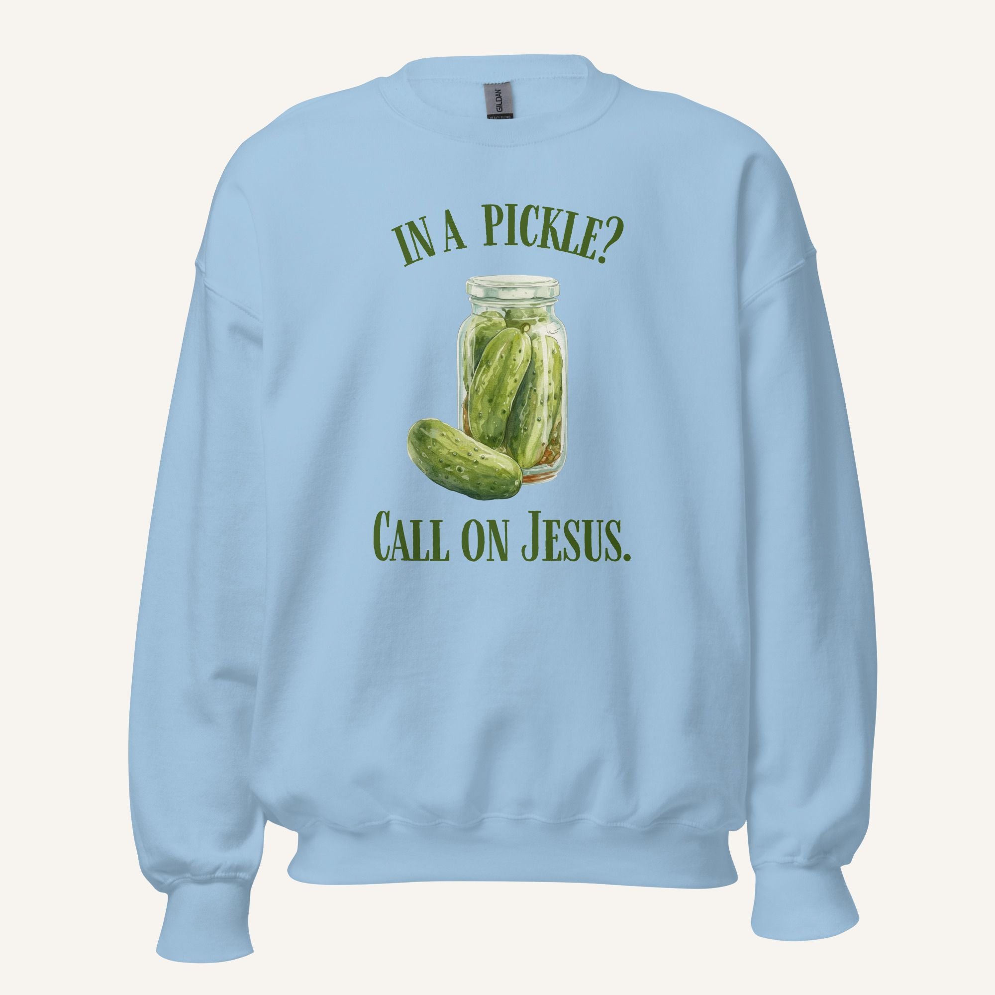 light blue crewneck sweatshirt with a pickle jar graphic and 'In a Pickle? Call on Jesus' text on a cream background