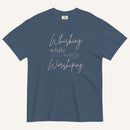 blue t-shirt with "Whisking while worshiping" text and a whisk graphic