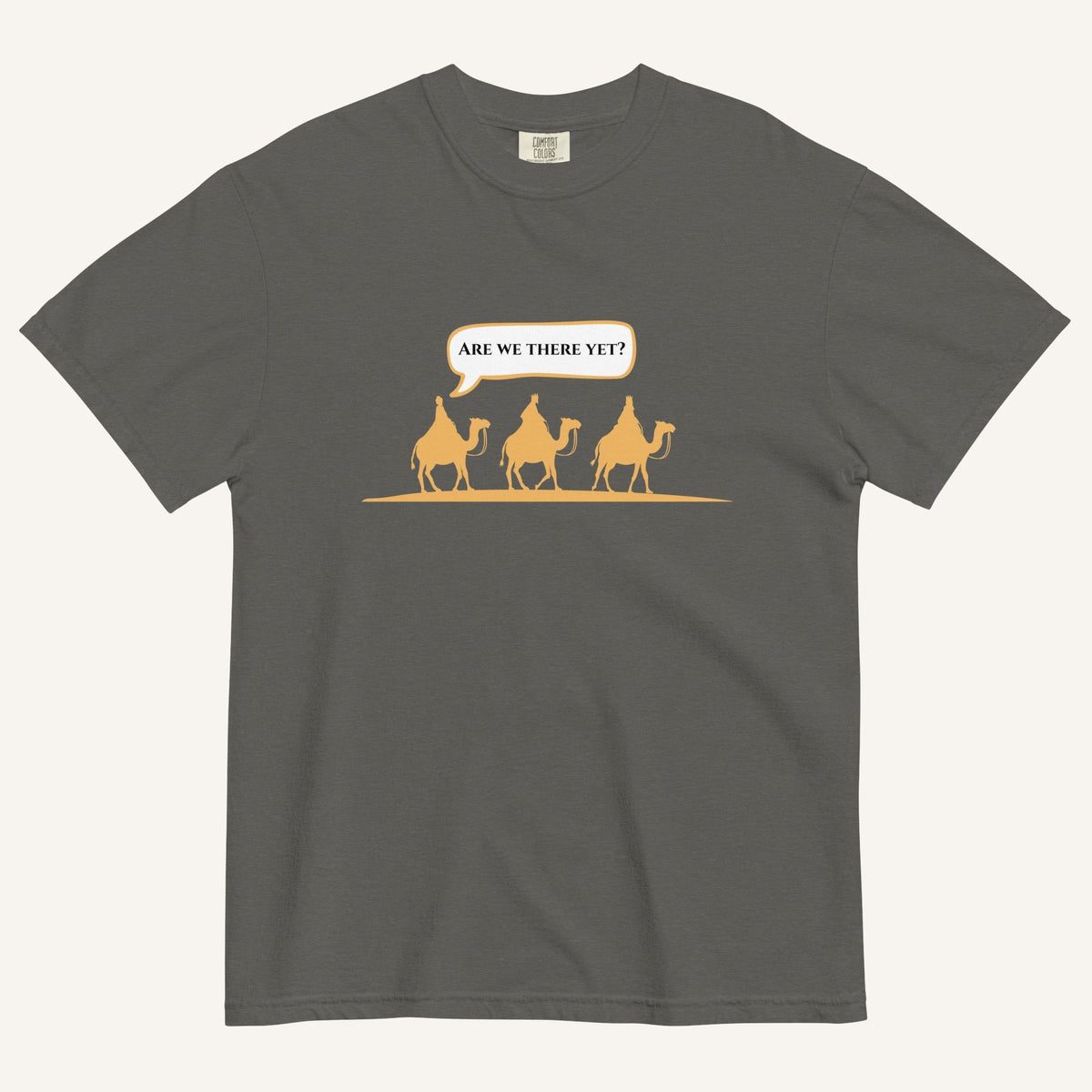 a grey t-shirt with 3 men riding camels in the color yellow with a chat bubble with the text "are we there yet?"