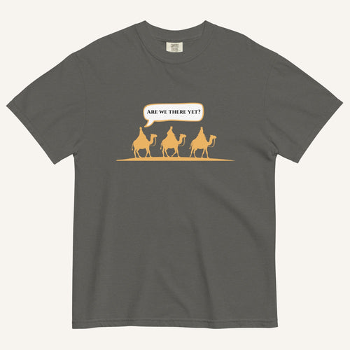 a grey t-shirt with 3 men riding camels in the color yellow with a chat bubble with the text "are we there yet?"