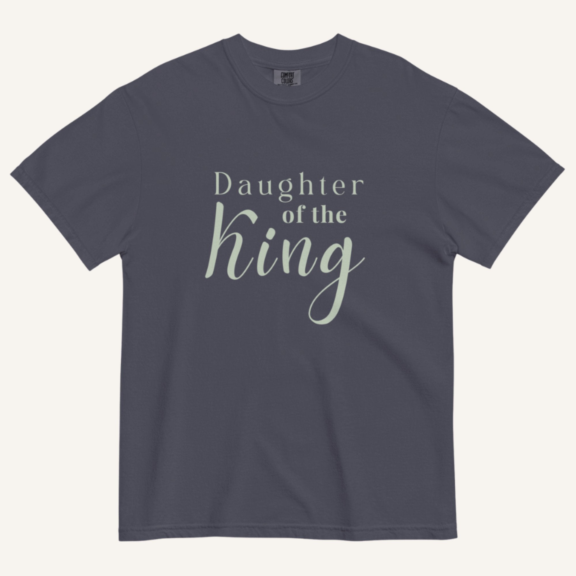 Navy blue t-shirt with 'Daughter of the King' text on a white background